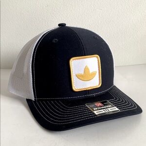 Richardson Black and White Trucker Hat with Yellow Logo